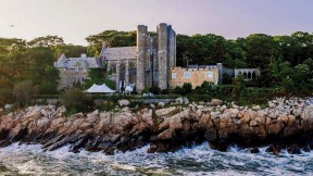 Majestic twentieth-century stone castle perched on Gloucester coastline