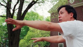 Master Yon Lee extends his hands in a tai chi pose.