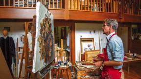 Jason Bouldin at work on a painting in his studio