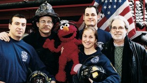 Four New York firefighters with John Weidman and <i>Sesame Street</i> character Elmo in 2001. 