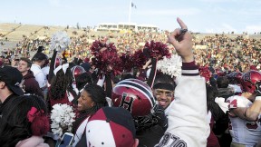 Harvard followers stormed the field at Yale Bowl to join players celebrating the Crimson&rsquo;s seventh straight victory over the Blue. 