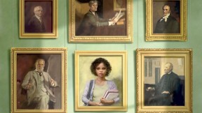 A wall of formal portraits, five representing white male Harvard faculty and administrators, one representing a black undergraduate woman
