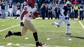 Photograph: With Yale’s Melvin Rouse II in vain pursuit, Harvard’s Aidan Borguet heads for the goal line. 