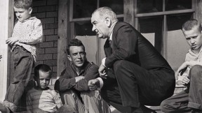 Historic photograph of President Lyndon Johnson meeting with impoverished Fletcher family in Kentucky in 1964