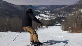 Skier in action at the top of a snow of snow-covered Berkshire East mountain 