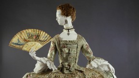 Ornate eighteenth-century dress with wide hooped skirt