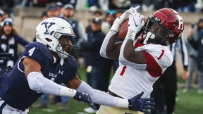 Wideout Kym Wimberly hauls in Luke Emge’s third-down, last-seconds, no-timeouts pass to secure Harvard’s thrilling 31-27 victory in The Game. 