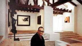 In a 1966 image taken in the Museum of Abstract Spanish Art in Cuenca, Zóbel holds one of his sketches; his painting <em>Ornitóptero</em> hangs behind him. At left is <em>Homenaje a Vasarely II,</em> a sculpture by Amadeo Gabino; the painting at far right is <em>Barrera con rojo y ocre,</em> by José Guerrero.
