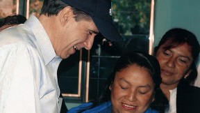 Julio Frenk, as Mexico’s minister of health, administers oral polio vaccine to a baby in a rural  community during National Health Week in 2005.