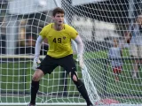 Soccer player and goalkeeper Matt Freese standing in front of the net