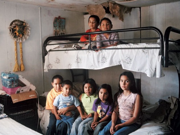 Seven Mexican immigrant children inside an old mobile home, where they live with their single mother in Mission, Texas