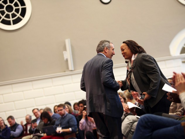 HGSE dean Bridget Terry Long and President Lawrence S. Bacow shake hands.