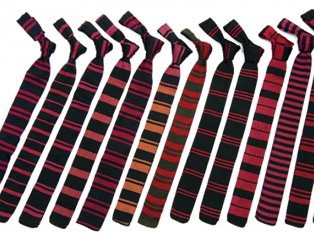 Photograph by Jim Harrison Neckties distinguished athletes in 14 major sports, with a generic tie for all minor sports, says Renny Little, curator (pro bono) of the Lee Family Hall of Athletic History. Here (from left) are those for football, soccer, cross country, track and field, ice hockey, swimming, basketball, wrestling, lacrosse, baseball, lightweight crew, golf, and minor sports. Missing are those for heavyweight crew and squash.