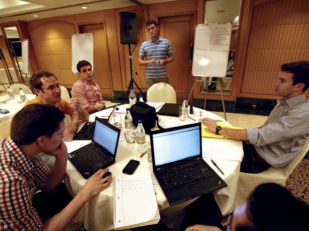 Photograph by Peter Pereira Back at their hotel, the students (from left)—Thomas Lydick, Steven Pearson, Frederic Dijols, Chris Bruce, Nafis Atiqullah, and Jeff Suer—regroup to consider what they will recommend.