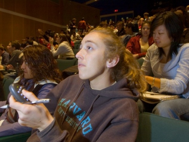 ...while Julia Pederson ’07 registers her answer with a handheld clicker...
