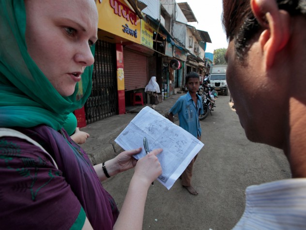 Photograph by Peter Pereira A group of public-health students practiced field methods by studying sanitation in Mumbai's Cheeta Camp slum. Here, Rosemary Wyber maps the locations of toilet buildings with guidance from local residents.