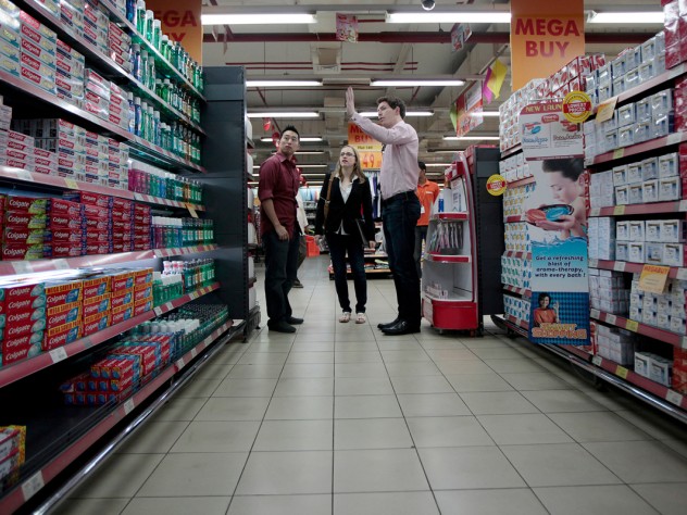 Photograph by Peter Pereira A new required course places almost all the 900 first-year M.B.A. students in one of 10 foreign countries for a weeklong project; the largest contingent went to India. In Mumbai, one student team worked with a chain of “hypermarkets” trying to win business from small neighborhood grocery stores. Here, Alex Pak, Parilee Edison, and Evan Sketchley analyze store displays.
