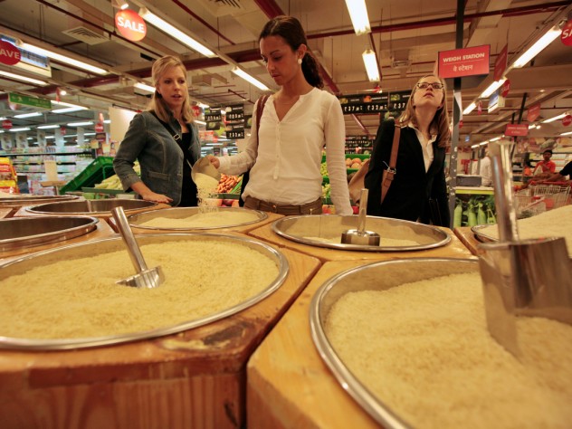 Photograph by Peter Pereira Kara Scarbrough, Alma Donohoe, and Edison examine the many varieties of rice for sale at this hypermarket.
