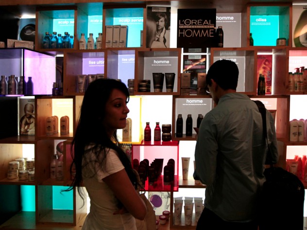 Photograph by Peter Pereira Another group advised a company on introducing a new line of hair-care products. Here, M.B.A. student Nafis Atiqullah (right) examines a product display at a hair salon. At left is Riddhi Paleja; her aunt, the Harvard students' local guide, brought her along for the day because she thought the students might find it informative to interview her. She is, her aunt said, "the only person I know who uses a lot of hair products."