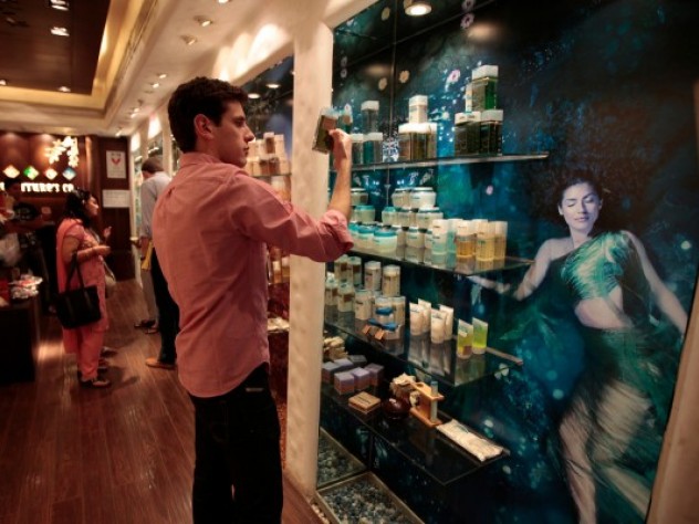 Photograph by Peter Pereira Considering how to position a new product line involves becoming acquainted with other products on the market. M.B.A. student Frederic Dijols reads product descriptions at The Nature's Co., a chain store that emphasizes use of natural ingredients and the influence of Ayurveda (Indian traditional medicine).