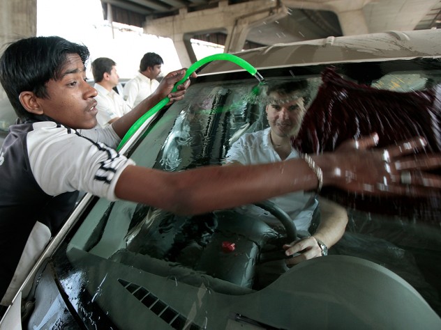 Photograph by Peter Pereira Visiting a Mahindra First Choice Wheels used-car dealership in Mumbai to advise the chain on better connecting with its customers, first-year M.B.A. students left no detail unnoticed. Here, Mike Diverio gets behind the wheel of a Tata Nano being washed by a worker.