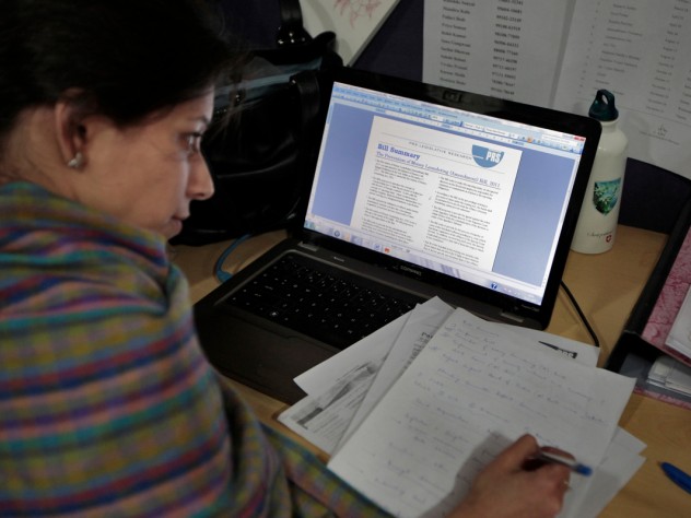 Photograph by Peter Pereira Khanna's students also learn about PRS Legislative Research, a Delhi-based nonprofit organization that provides research briefs to members of Parliament on bills they are considering. Here, a researcher works on a brief in the PRS office.