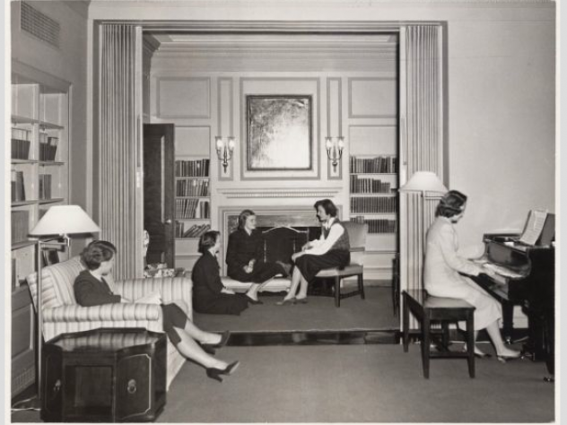 Photograph by Ronald E. Stroud, courtesy of the <a href="http://www.radcliffe.edu/schlesinger_library.aspx">Schlesinger Library</a>, Radcliffe Institute, Harvard University A group of Radcliffe students socialize in a common room in Moors Hall circa 1950.