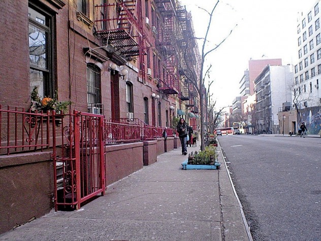 Photograph by Bob Egan A recent photo of the Hell’s Kitchen block on West 56th Street between Ninth and Tenth Avenues, Manhattan, where the cover of the 1957 <i>West Side Story</i> cast album (superimposed in the next image) was shot. Egan spotted the address “418 W 56 St” on the garbage can to the left of the heroine, Maria.