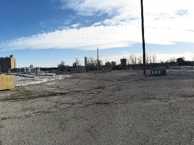 Photograph by Jonathan Shaw An enterprise research campus (see photo position C on map) is planned for a 36-acre parcel formerly occupied by CSX. In the panoramic view above, Harvard Business School is on the left, Genzyme and the DoubleTree hotel are in the center, and the former WGBH building is on the right. (<a href="http://harvardmagazine.com/sites/default/files/img/article/0215/img_MA15_p27_01.jpg">Click to view a larger image.</a>)
