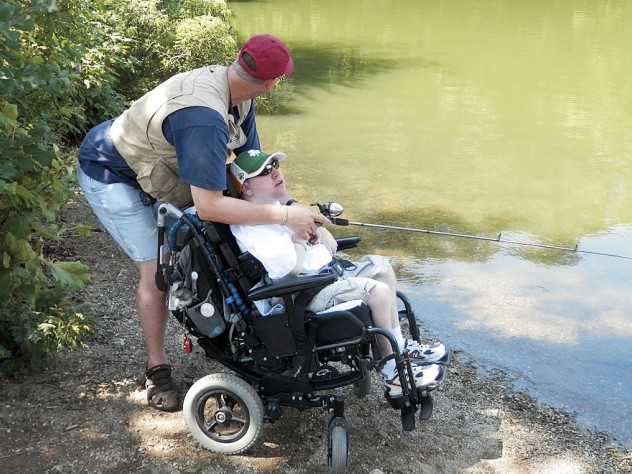 Tim Stevens, a longtime patient, fishes with his stepfather.