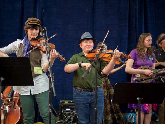 Three fiddlers playing