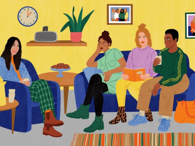 Four young women of different ethnic backgrounds converse in a homey lounge 