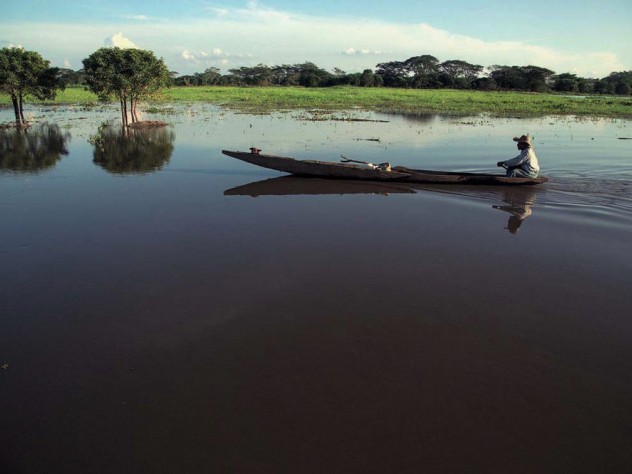 A Colombian fisherman in his boat on one of the Magdalena River's wetlands