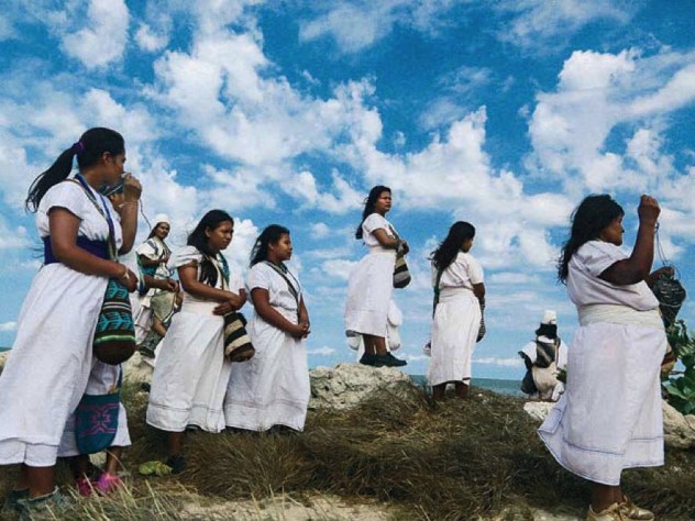Women making offerings to the Magdalena River in Colombia
