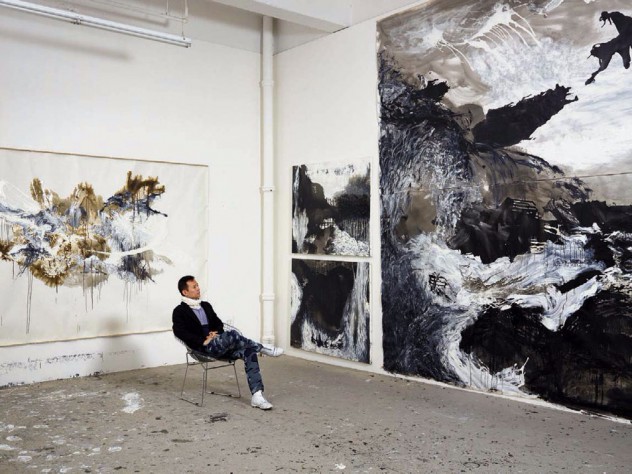 Artist Shen Wei in his studio amid his large-scale abstract paintings 