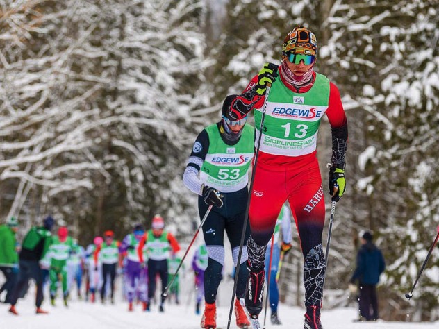 James Kitch on a trail, skiing in front of a competitor