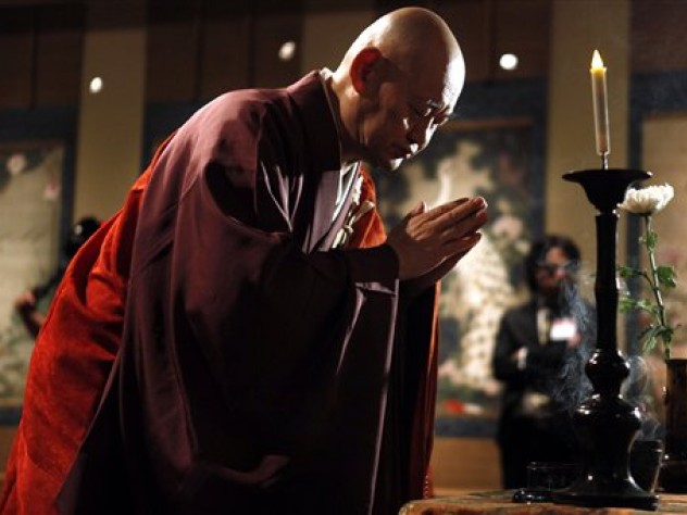 Photograph by Jacquelyn Martin/The Associated Press Reverend Raitei Arima, chief priest of Shokokuji Monastery in Kyoto, performs a blessing ceremony over a 30-scroll set of paintings from the 1700s, considered a cultural treasure of Japan, on March 26 at the National Gallery of Art in Washington, D.C. The museum is displaying the paintings, by Ito Jakuchu, to mark the centennial of Japan's gift of 3,000 cherry trees to the nation's capital.