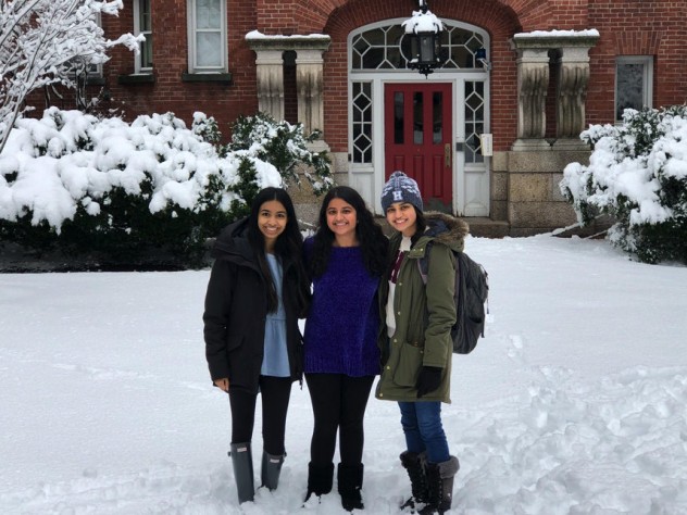 The author and her two roommates stand in the snow in front of their future home at Harvard.