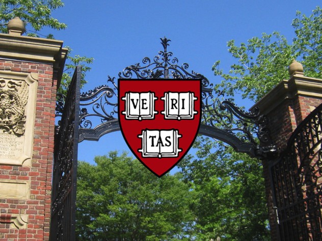 An open gate with the Harvard shield