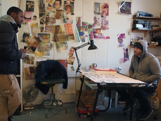 Craig and Krimes talk in an art studio
