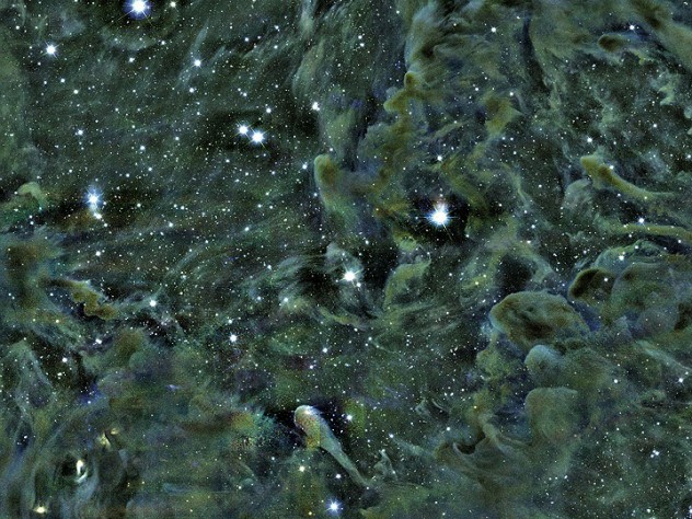 Part of the Perseus molecular cloud, as seen through the Smithsonian’s MMT telescope in Arizona. Self-gravitating structures—dense areas where stars are forming—appear as dark spots. The L1448 region is located in the upper-right quadrant of the image.