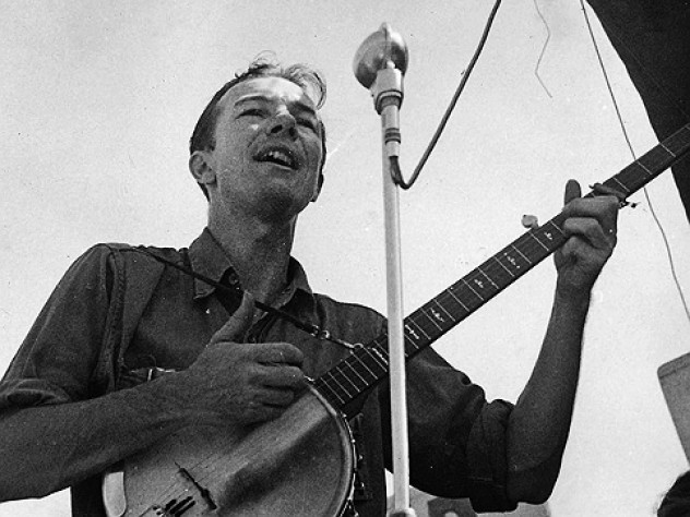Pete Seeger, shown singing in an undated photo, traveled light, always ready to make music.
