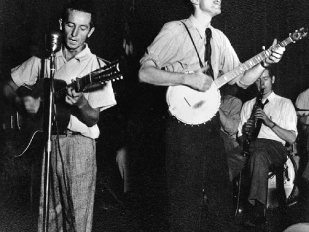 Woody Guthrie (left) and Seeger in 1941; they first met in 1939.