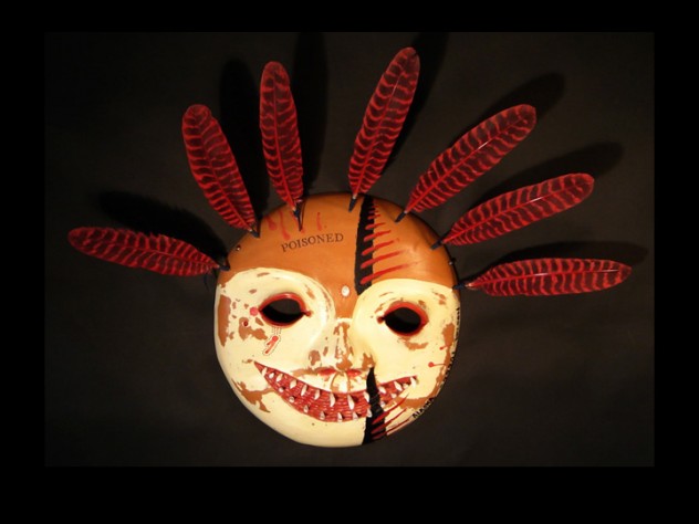 Courtesy of Phillip Charette Charette traveled to the Smithsonian Institution in 2003 to view the museum’s Yup’ik holdings; the mask above, from his Poisoned series, shows that trip’s influence and comments on the way museums handled Native American art objects, many of which have sacred value. Charette saw many Yup’ik masks that had been treated with arsenic as a pesticide when the museum acquired them, then further defiled by stamping them with the word “poisoned” once the dangers of topical exposure to arsenic became known.