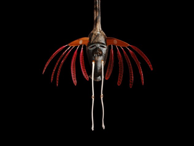 Courtesy of Stonington Gallery The crane is a meaningful animal in Yup'ik lore and for Charette personally (see first image in this slide show). This four-foot-tall mask, from an Oregon art gallery, features a full crane face and head on top, and a human-like face on the animal's body to represent its <em>yua</em>. This mask, from Charette's <em>Transformation</em> series, is made of horsehair-fired clay, with porcelain "bone" legs and wild-turkey feathers in place of the raptor features used in Yup'ik masks of old.