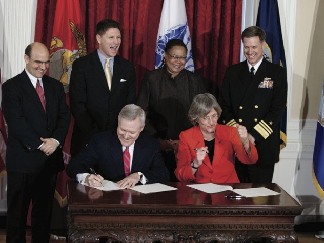 Photograph by Rose Lincoln/Harvard News Office Done deal. U.S. Secretary of the Navy Ray Mabus and President Drew Faust sign the ROTC agreement as (left to right) Vice President and General Counsel Robert Iuliano, Assistant Secretary of the Navy Juan M. Garcia III, Dean of Harvard College Evelynn Hammonds, and Vice Admiral Mark E. Ferguson III look on.