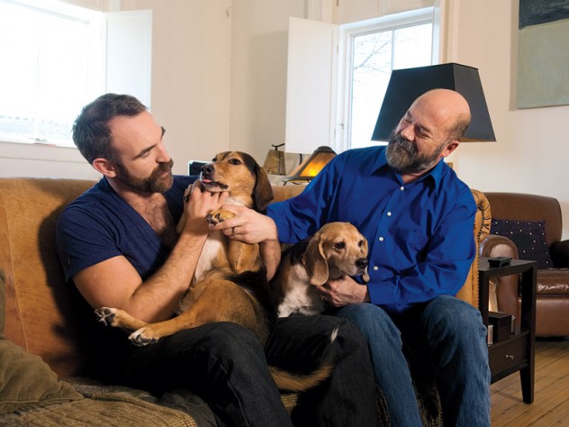 Sullivan (right)  at home with his husband, actor Aaron Tone, and their  two beagles
