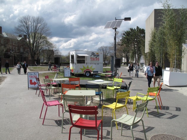 Photograph by Harvard Magazine/JC 10. Harbingers of things to come: the seasonal casual seating, a food truck, and the temporary planters in front of the Science Center, as of last April
