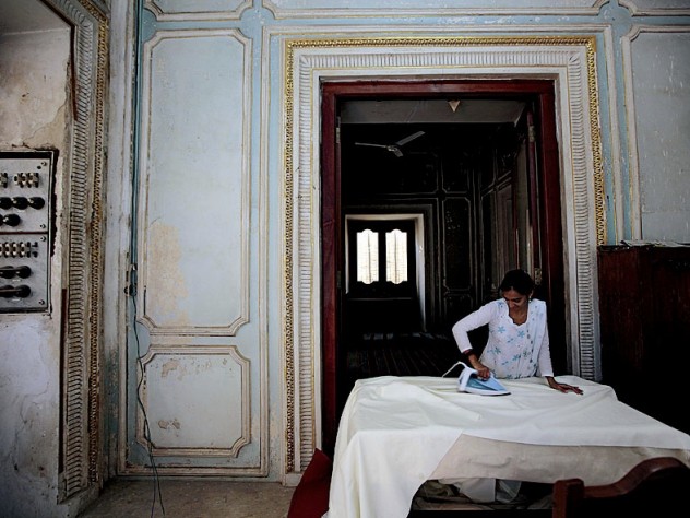 Photograph by Peter Pereira In a workshop area of the palace complex that is closed to the public, seamstresses sew and iron dozens of sets of curtains for the palaces.
