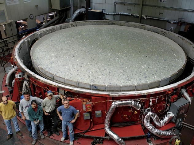 Photograph by Ray Bertram/Courtesy of the University of Arizona Steward Mirror Lab At the Steward Observatory Mirror Lab, in Tucson: with the raw glass in place, the rotary kiln can be covered and prepared for heating.